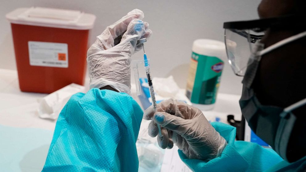 PHOTO: A health care worker fills a syringe with the Pfizer COVID-19 vaccine, July 22, 2021, at the American Museum of Natural History in New York.