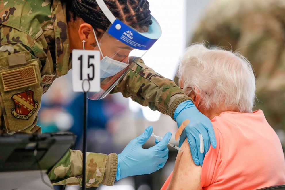 PHOTO: A woman receives a Pfizer COVID-19 vaccine at a vaccination center established at the Triton College in River Grove, Illinois, on February 3, 2021.