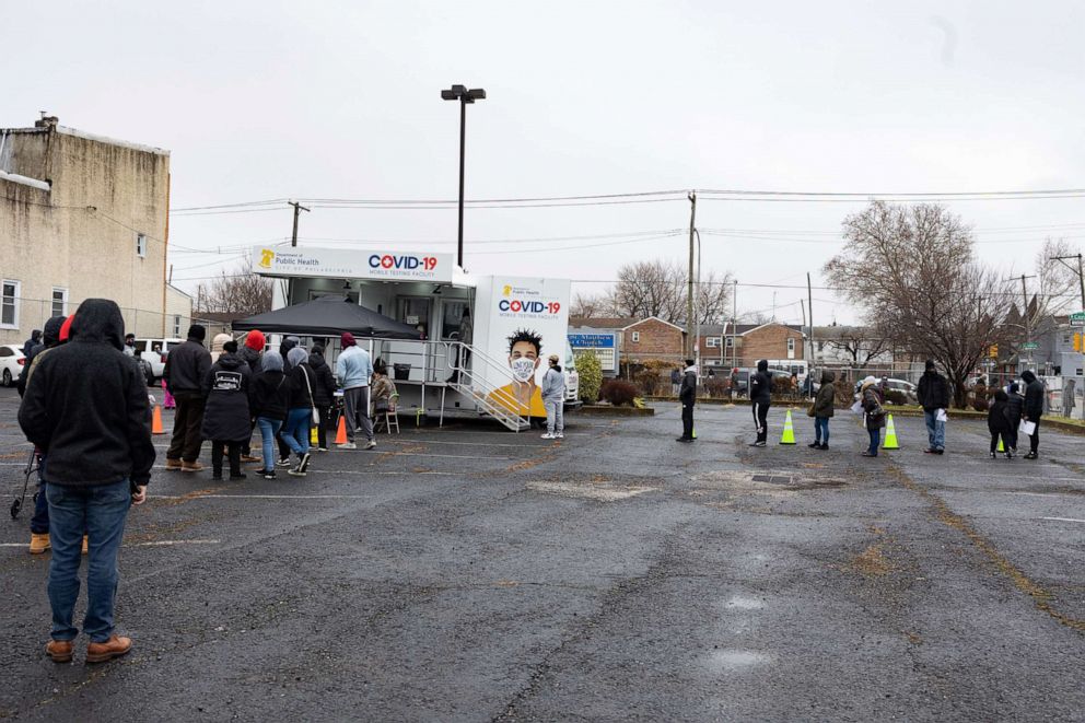 PHOTO: In this Dec. 30, 2021, file photo, residents wait in line to receive a COVID-19 test at a Philadelphia Department of Public Health mobile testing site in Philadelphia.