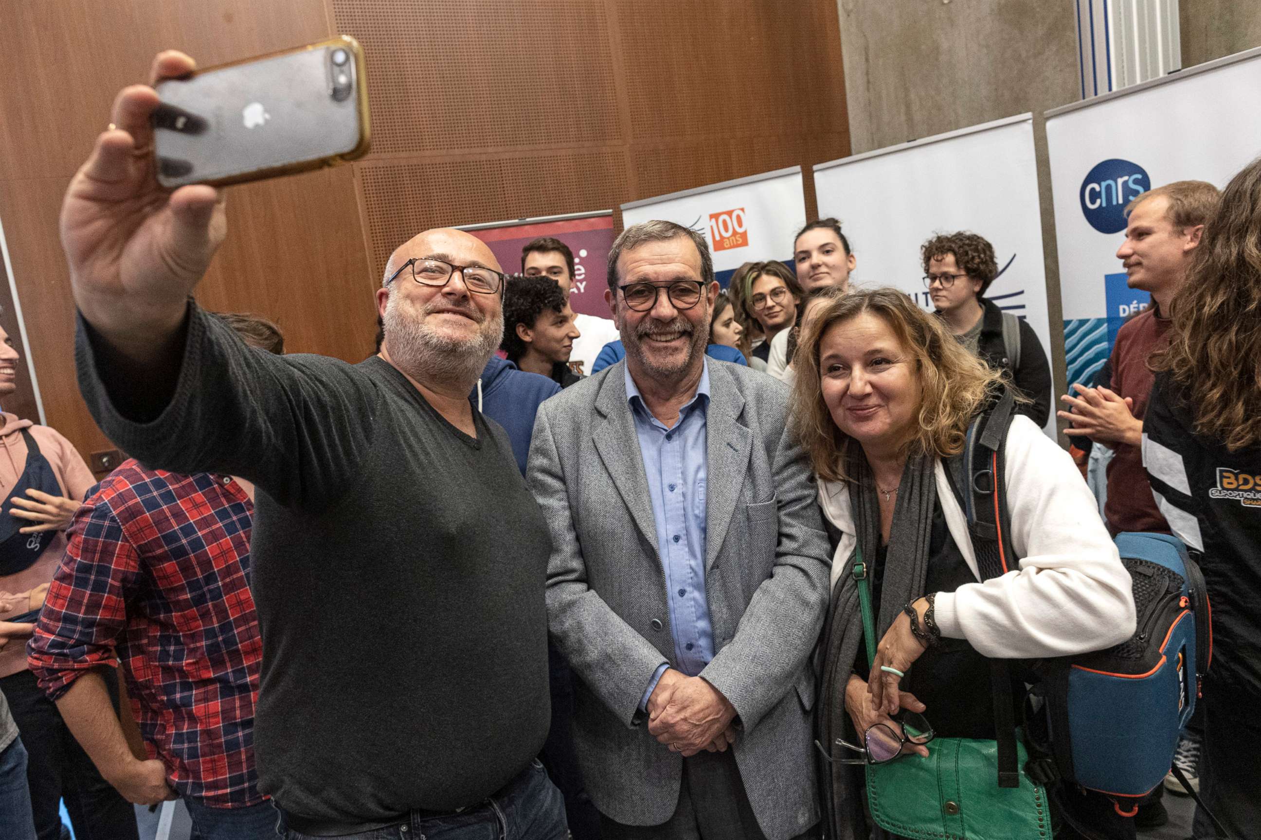 PHOTO: French physicist Alain Aspect takes photos with wellwishers at a press conference after winning the Nobel Prize, on Oct. 4, 2022 in Palaiseau, France. The Nobel Prize in Physics 2022 was awarded jointly to Aspect, John F Clauser and Anton Zeilinger