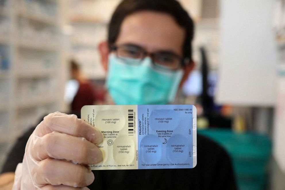 PHOTO: Pharmacy manager Oscar Uribe holds a package of Pfizer's Paxlovid pills, a treatment for COVID-19, inside of Esperanza Health Center in Chicago, Jan. 13, 2022.