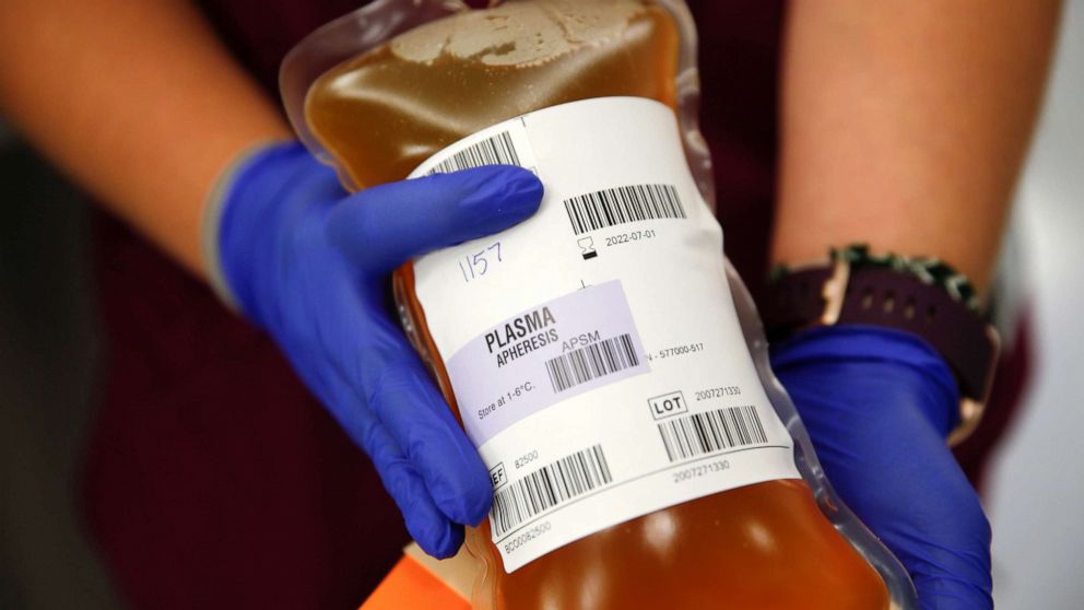 PHOTO: Blood collection specialist Kathryn Severson holds a bag of convalescent plasma from a recovered coronavirus patient at the Central Seattle Donor Center of Bloodworks Northwest during the COVID-19 outbreak, in Seattle, Sept. 2, 2020.