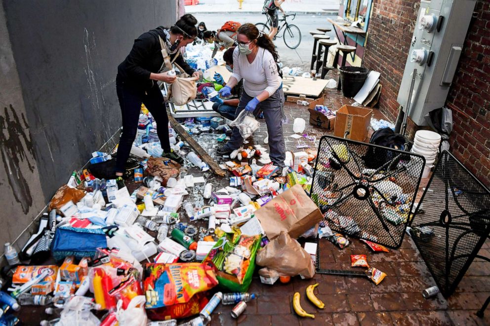 PHOTO: The alleyway to One World Brewing is left in disarray after Asheville Police tipped over tables of food and medical supplies, June 2, 2020 in Asheville, N.C.