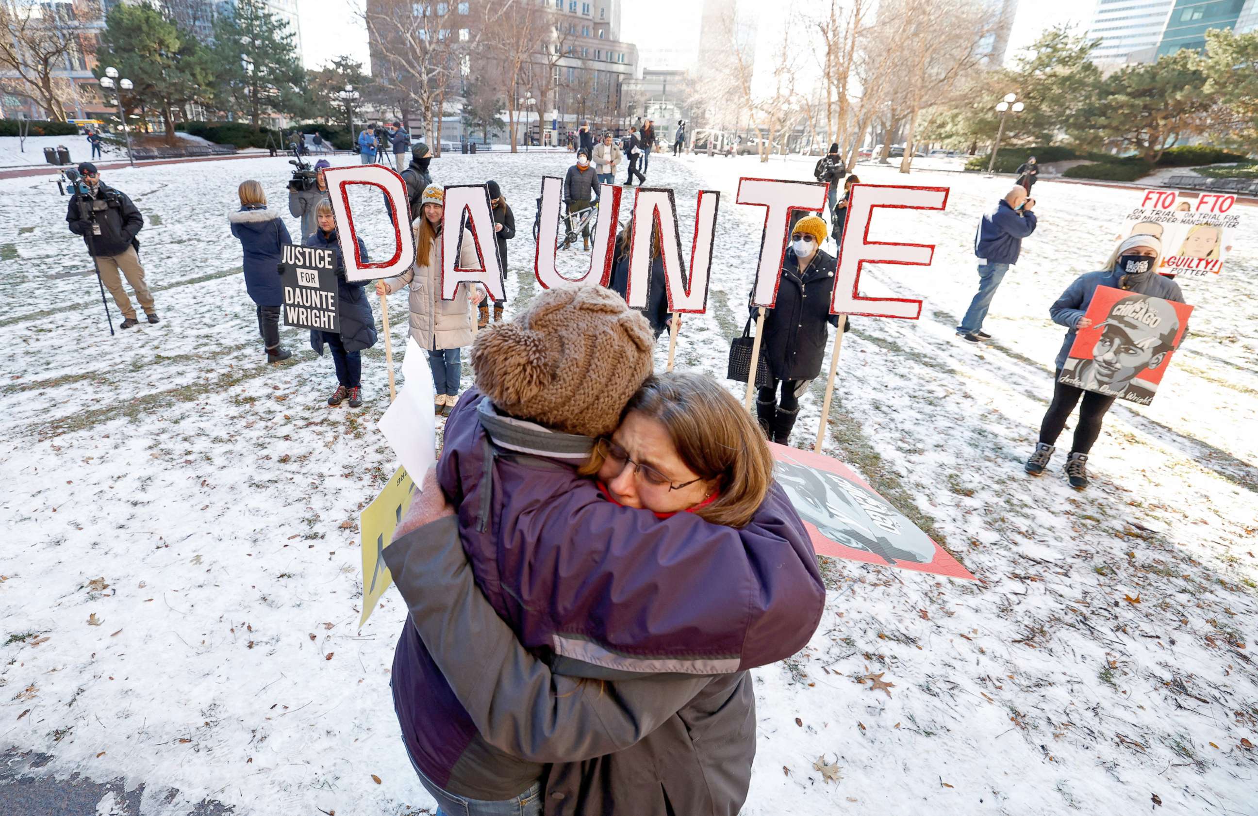 PHOTO: People react to the outcome in the manslaughter trial of Kimberly Potter,  outside the Hennepin County Courthouse in Minneapolis, Minn., Dec. 23, 2021. Potter was found guilty in the fatal shooting of Daunte Wright. 