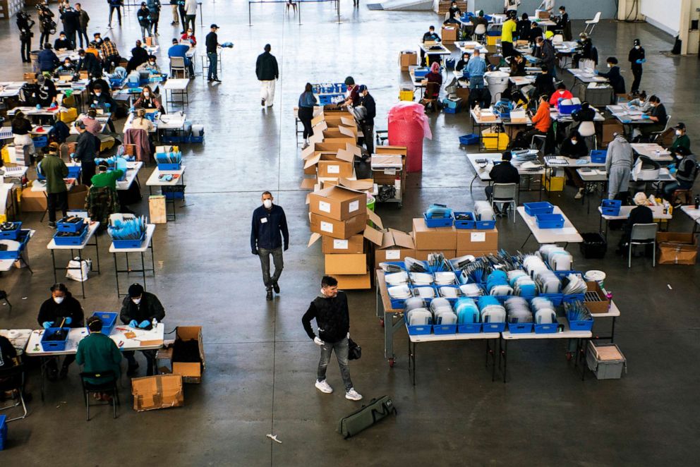 PHOTO: People make face shields at the Brooklyn Navy Yard where local industrial firms have begun manufacturing Personal Protective Equipment (PPE)  on March 26, 2020 in New York City.