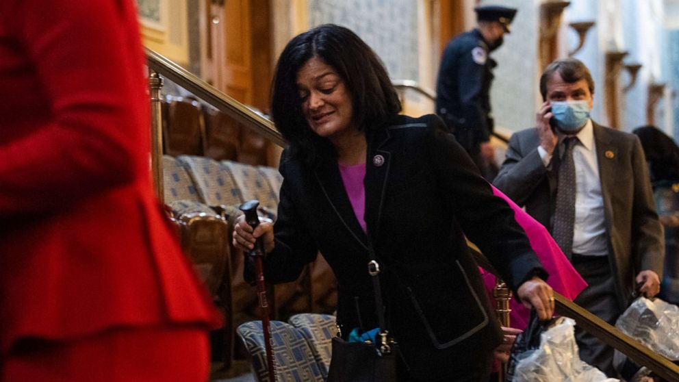 PHOTO: Rep. Pramila Jayapal and other members take cover as rioters disrupt the joint session of Congress to certify the Electoral College vote on Jan. 6, 2021.
