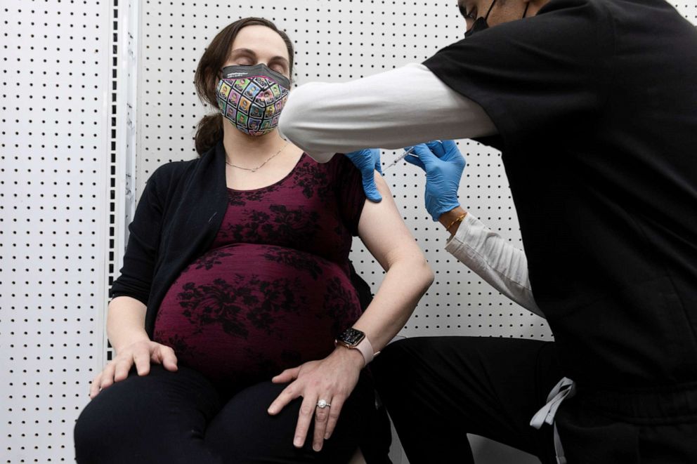 PHOTO: 	In this Feb. 11, 2021, file photo, a pregnant woman receives the COVID-19 vaccine at a pharmacy in Schwenksville, Pa.