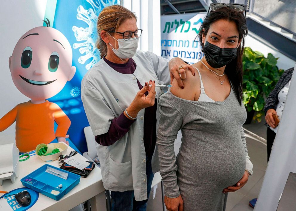 PHOTO: A health worker administers a dose of the Pfizer-BioNtech COVID-19 coronavirus vaccine to a pregnant woman in Tel Aviv, Jan. 23, 2021.