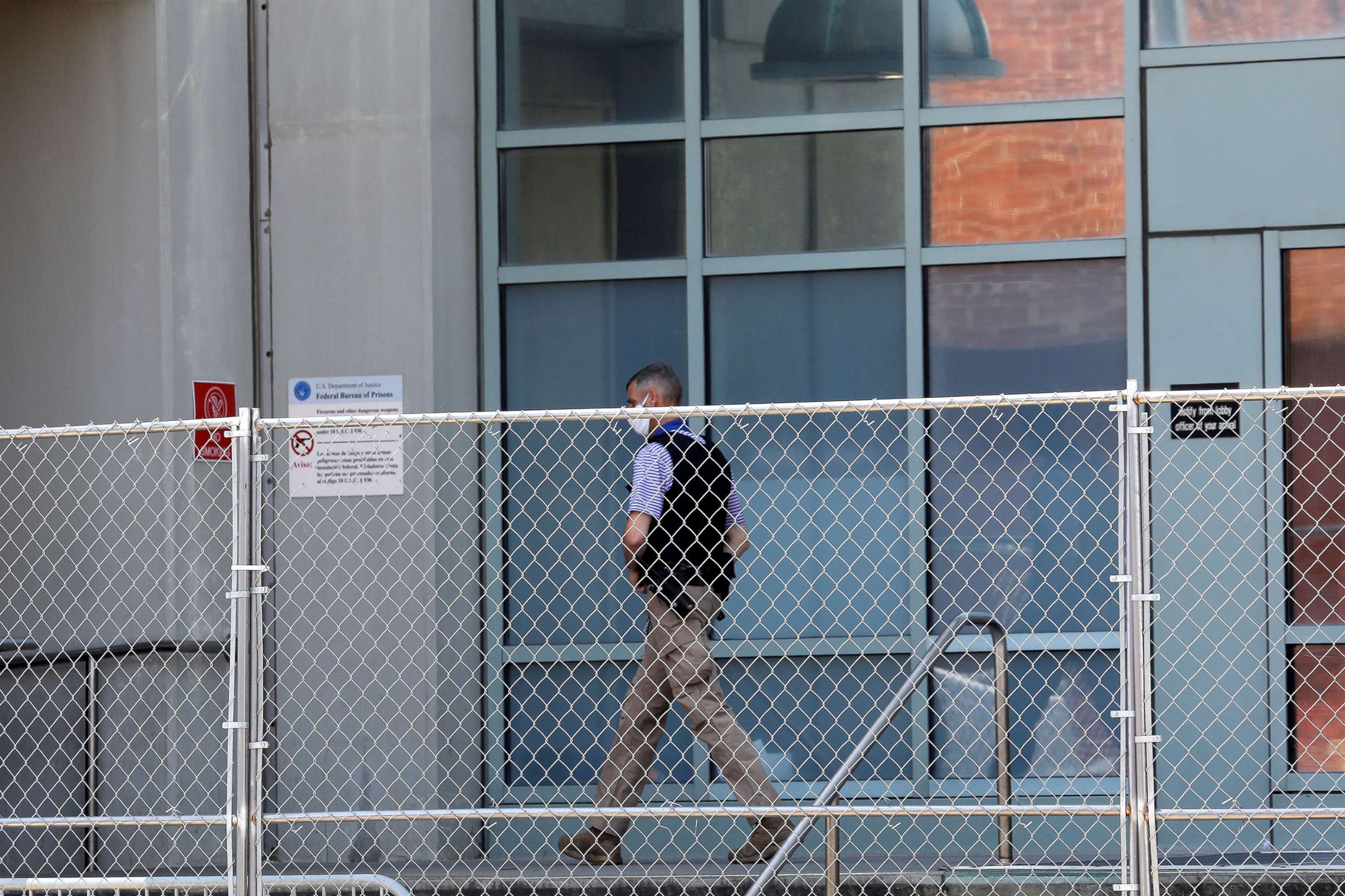 PHOTO: A law enforcement officer walks outside the entrance to The Metropolitan Detention Center (MDC), in the Brooklyn borough of New York, July 6, 2020. 