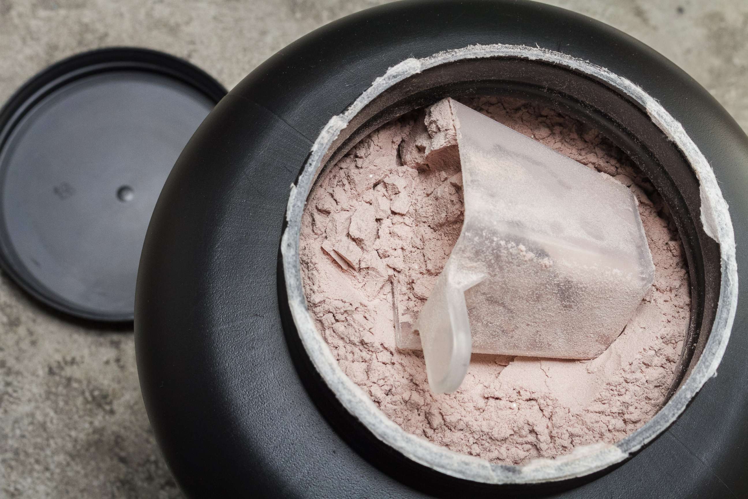 PHOTO: A scoop of fine whey protein powder sits in a container in an undated stock photo.