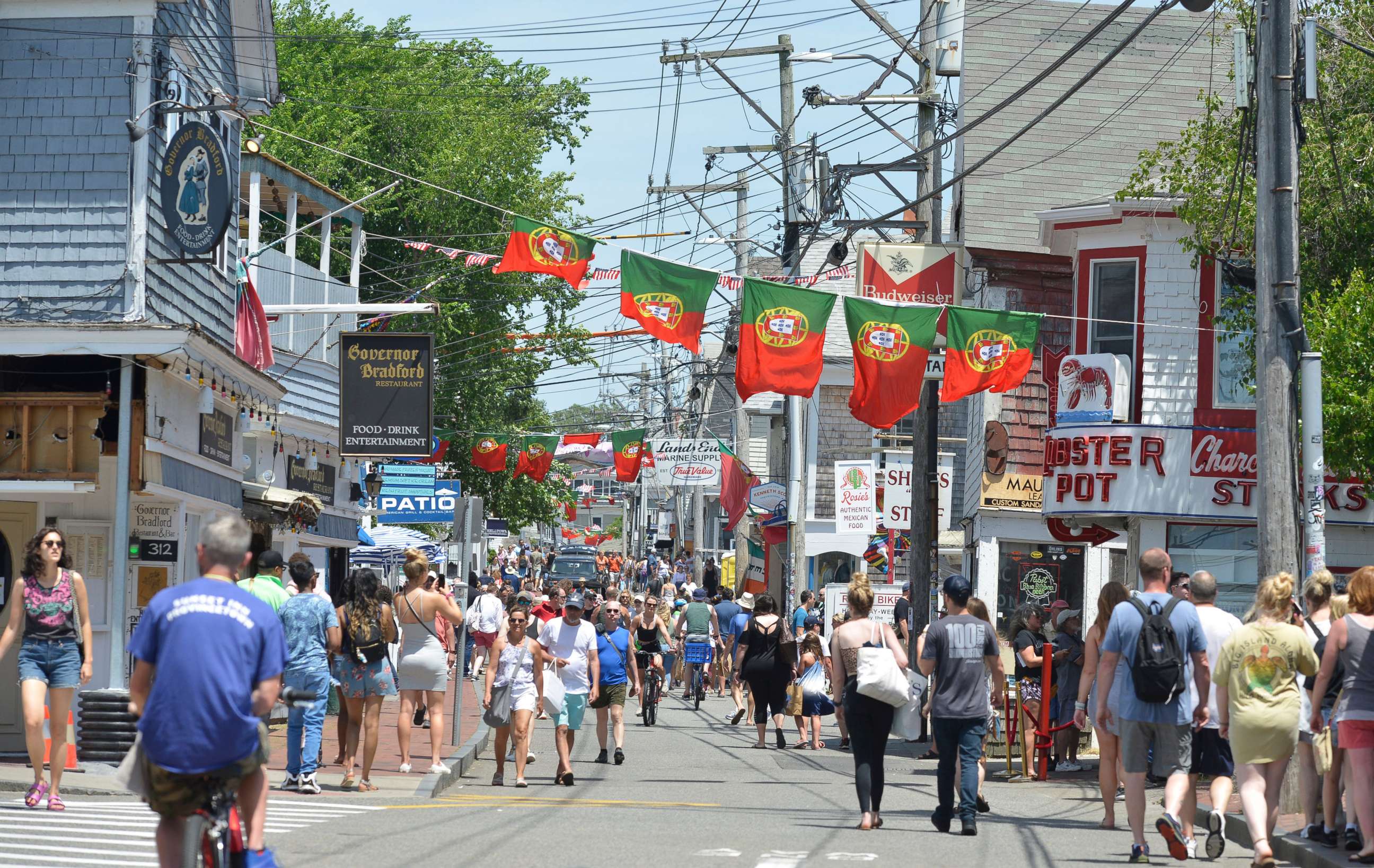 PHOTO: People walk on Commercial Street in Provincetown, Mass., on June 27, 2021.
