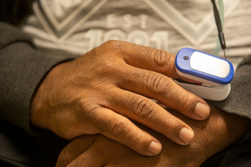 PHOTO: A discharged COVID patient utilizes a pulse oximeter to check their oxygen levels in Los Angeles, Feb. 23, 2021. 