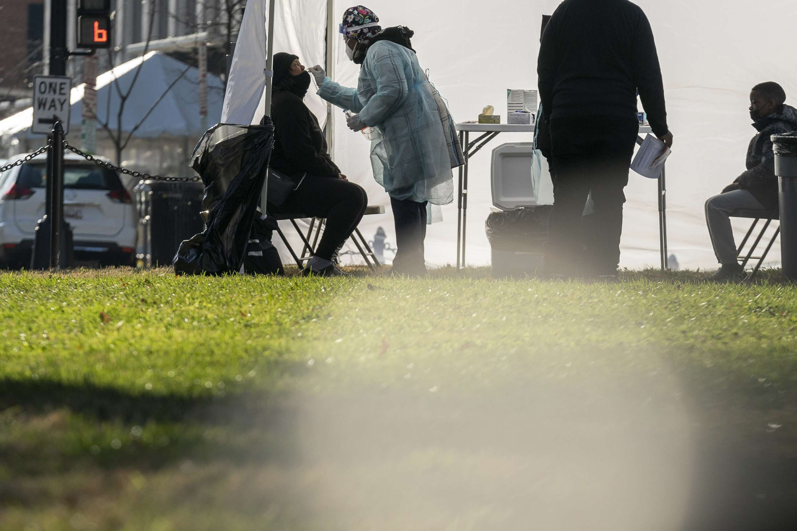 PHOTO: A healthcare worker administers a Covid-19 test at a testing site in  Farragut Square in Washington, Dec. 23, 2021. 