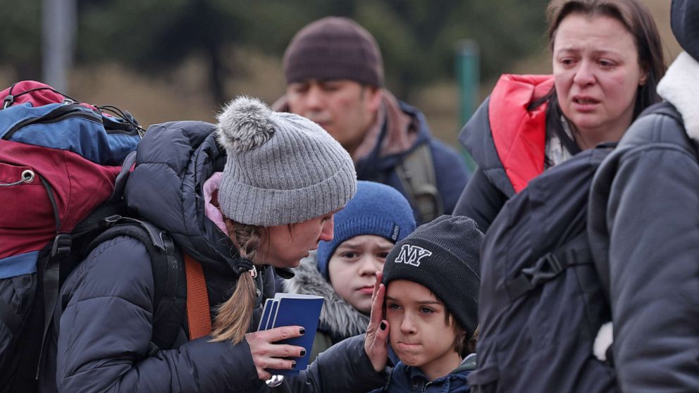 PHOTO: Families fleeing war-torn Ukraine wait to cross into Poland at the Korczowa crossing on March 2, 2022 near Korczowa, Poland.