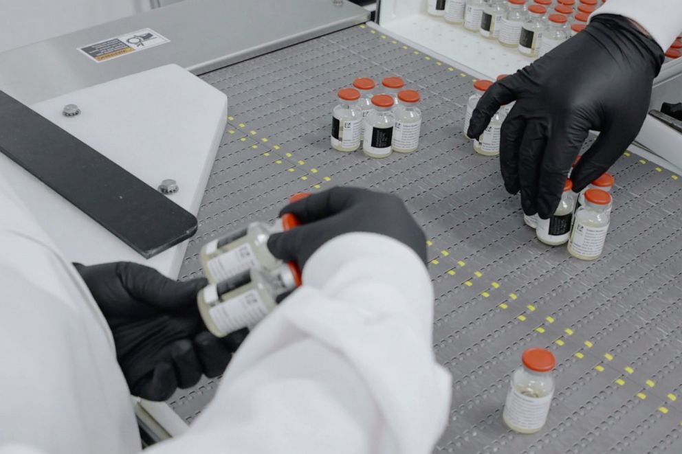 PHOTO: In this undated image from video provided by Regeneron Pharmaceuticals on Friday, Oct. 2, 2020, vials are inspected at the company's facilities in New York state, for efforts on an experimental coronavirus antibody drug. 