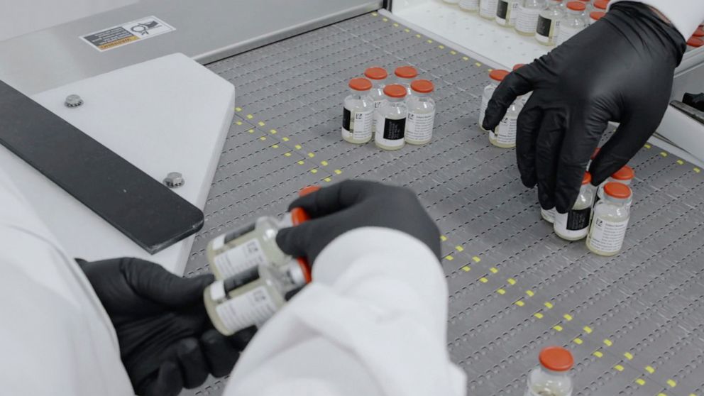 PHOTO: In this undated image from video provided by Regeneron Pharmaceuticals on Friday, Oct. 2, 2020, vials are inspected at the company's facilities in New York state, for efforts on an experimental coronavirus antibody drug.