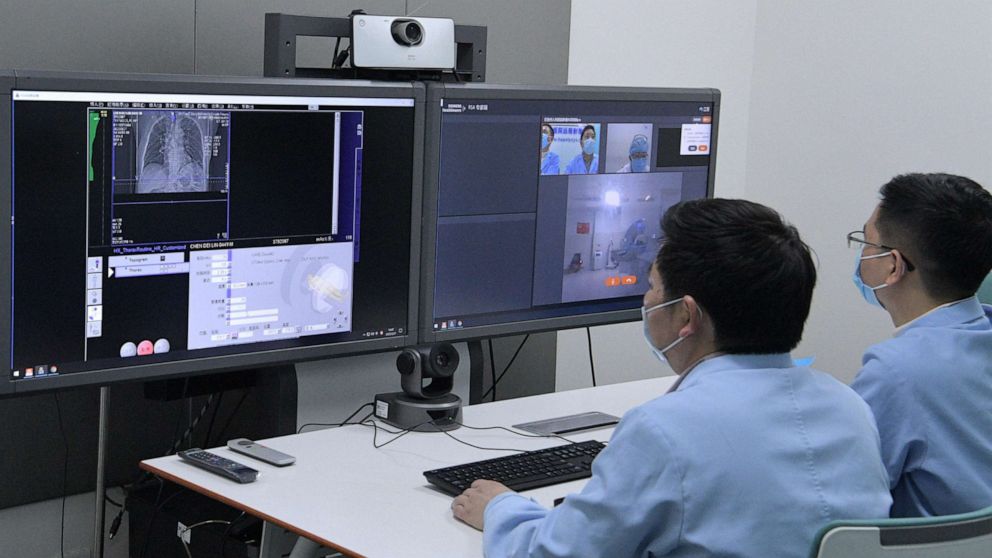 PHOTO: Doctors use 5G technology to diagnose COVID-19 patients on Feb. 27, 2020, at West China Hospital of Sichuan University, in Chengdu, Sichuan, China. Li Zhenlin, Deputy Director of the Radiology Department, has remotely diagnosed 17 patients so far.