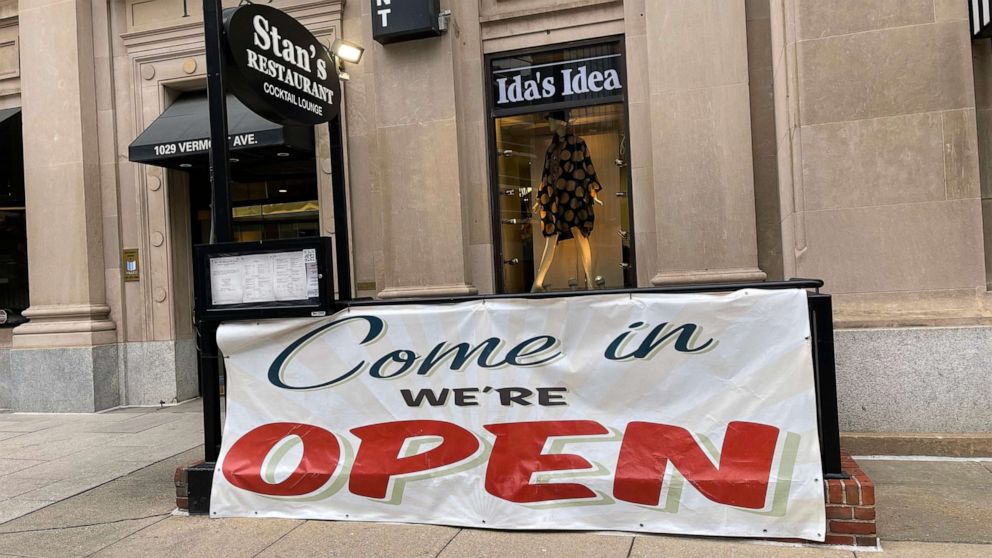 PHOTO: An open banner is seen outside a restaurant on Jan. 25, 2021, in Washington, D.C., as restaurants open indoor dining again, allowing a 25% capacity during the COVID-19 pandemic.