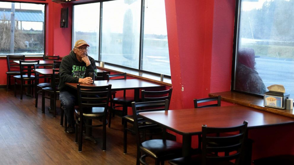 PHOTO: A man sits in the restaurant area of a gas station at Quinault Indian Nation's main village, on the Quinault Indian Reservation in Taholah, Wash. March 6, 2020.