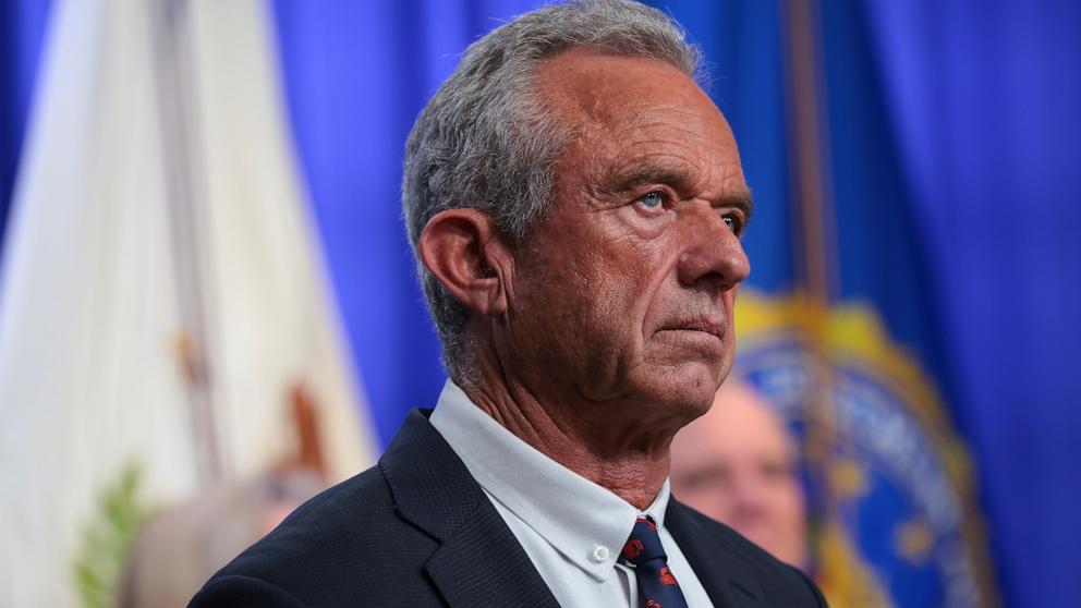 PHOTO: Secretary of Health and Human Services Robert F. Kennedy Jr. listens during a news conference at the at the Robert F. Kennedy Department of Justice building on June 23, 2026 in Washington, DC.