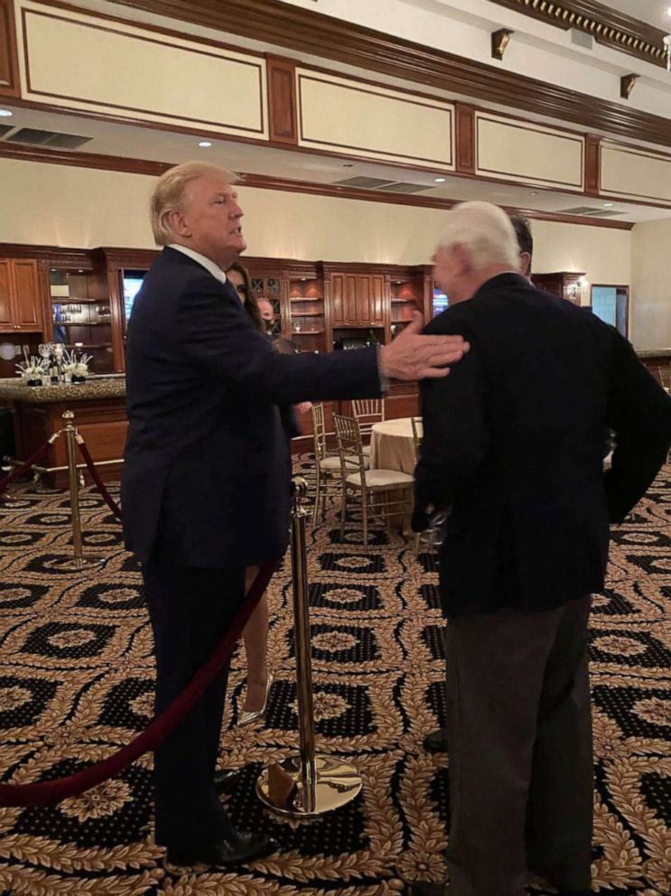 PHOTO: Roger Stone speaks with President Trump at the Trump International Golf Club in West Palm Beach, Fla., Dec. 27, 2020.
