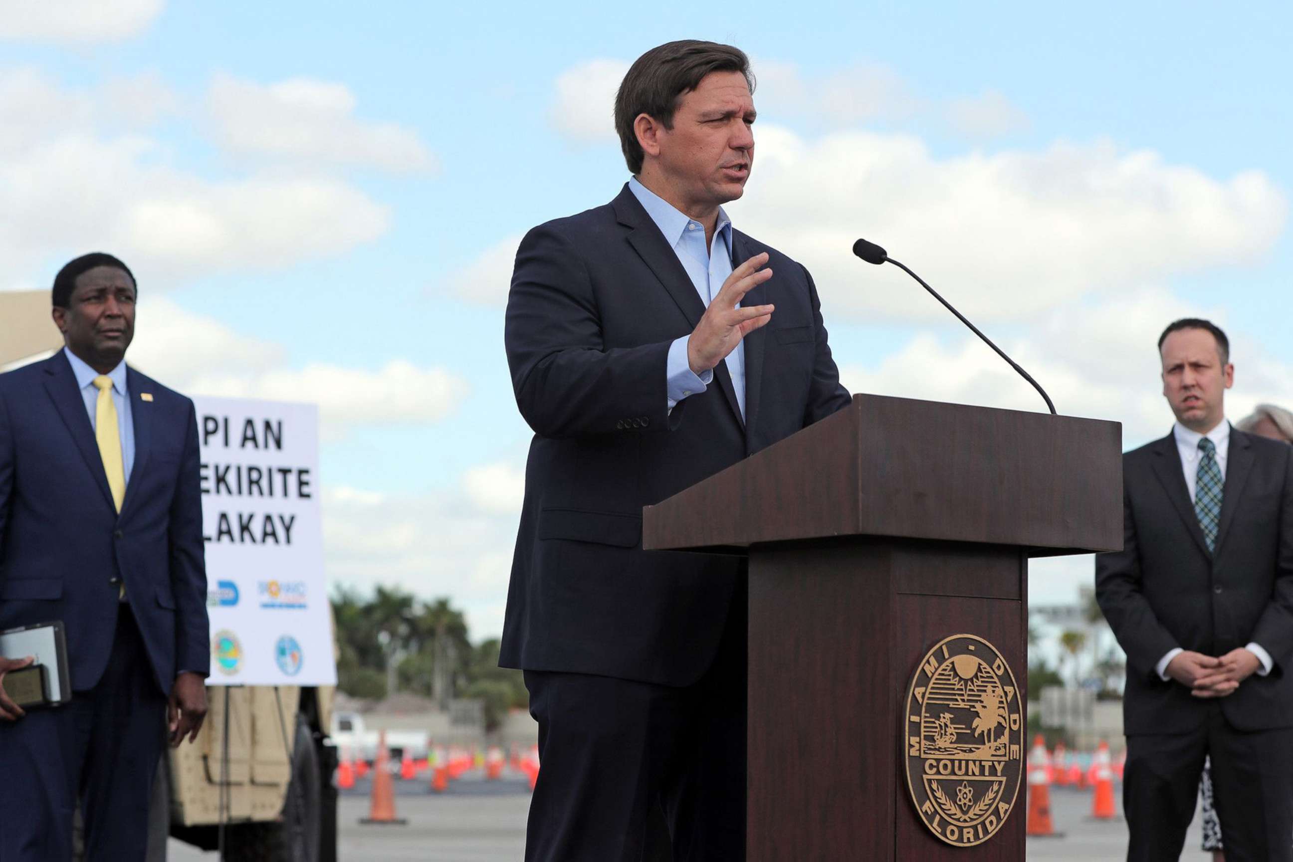 PHOTO: Gov. Ron DeSantis speaks at a news conference at the coronavirus drive-thru testing site at Hard Rock Stadium in Miami Gardens on March 30, 2020.