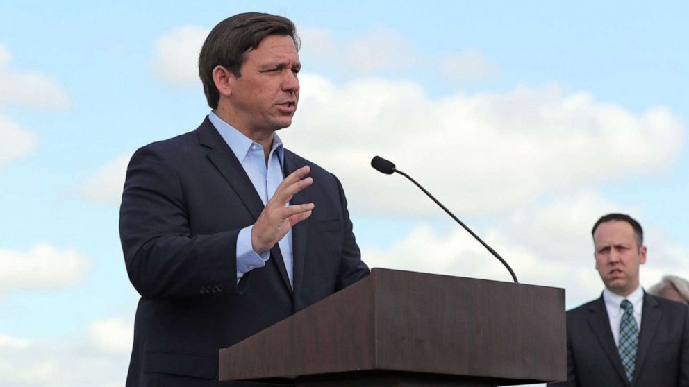 PHOTO: Gov. Ron DeSantis speaks at a news conference at the coronavirus drive-thru testing site at Hard Rock Stadium in Miami Gardens on March 30, 2020.