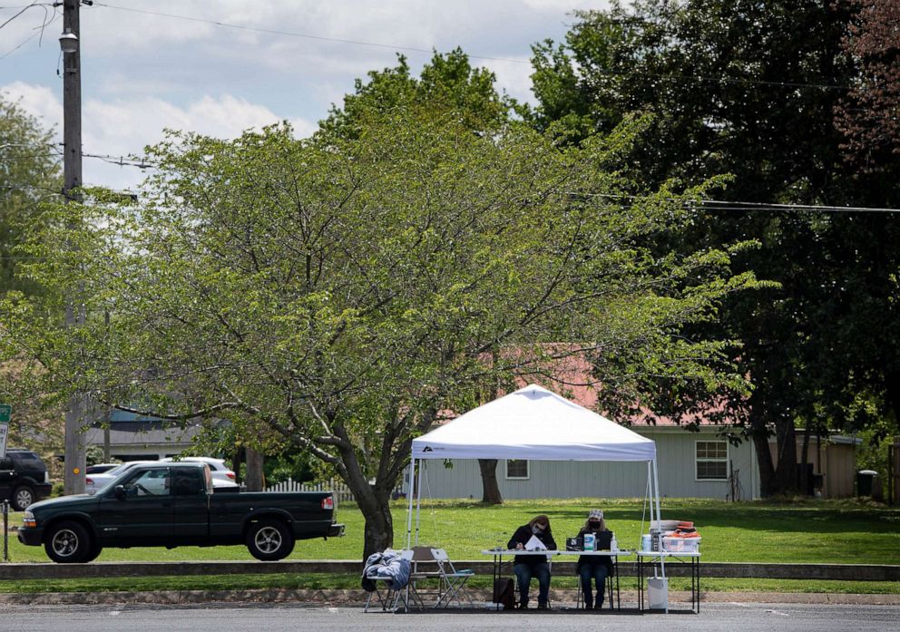 PHOTO: Kelly Mooneyham and Karen Willmore of Adhere Rx wait for COVID-19 vaccine recipients at a pop-up vaccination clinic in Portland, Tenn, April 22, 2021.