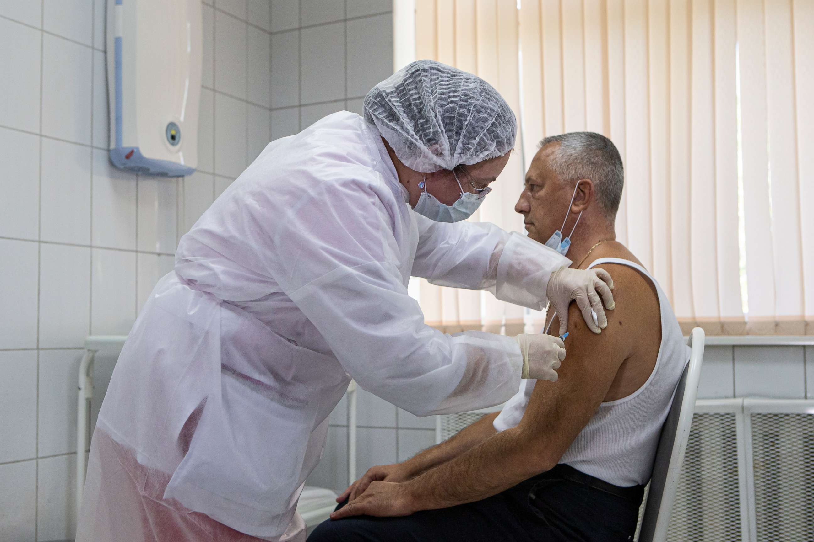 PHOTO: A Russian medical worker administers a shot of Russia's Sputnik V coronavirus vaccine in Moscow on Sept. 15, 2020. Russian health authorities have launched trials of the vaccine among 40,000 volunteers, a randomized, placebo-controlled study.