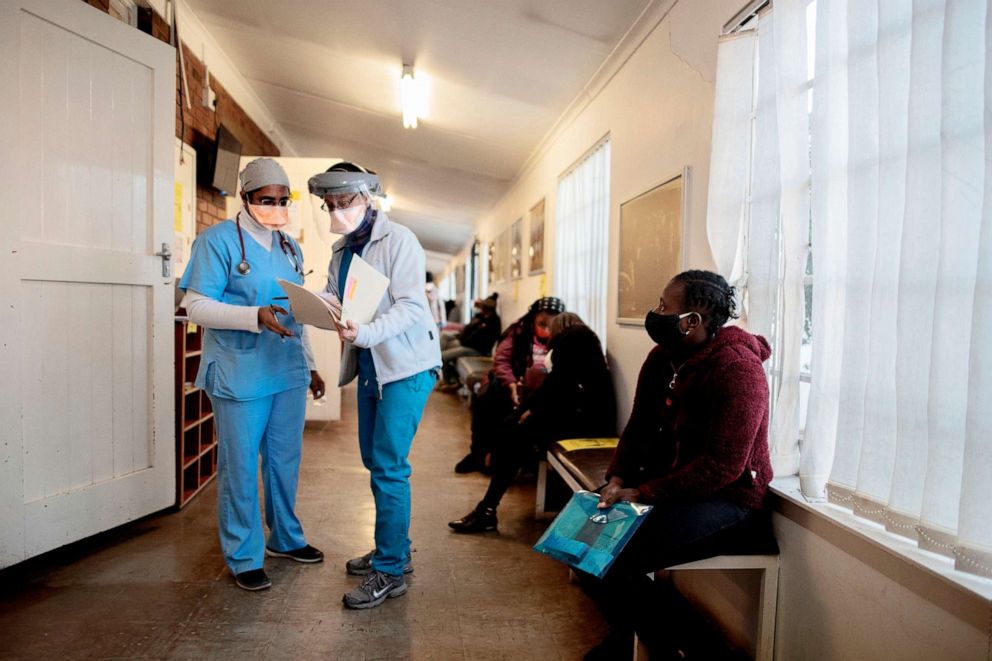 PHOTO: Doctors look at a files at the Respiratory & Meningeal Pathogens Research Unit at the Chris Hani Baragwanath Hospital in Soweto, South Africa, on July 14, 2020.