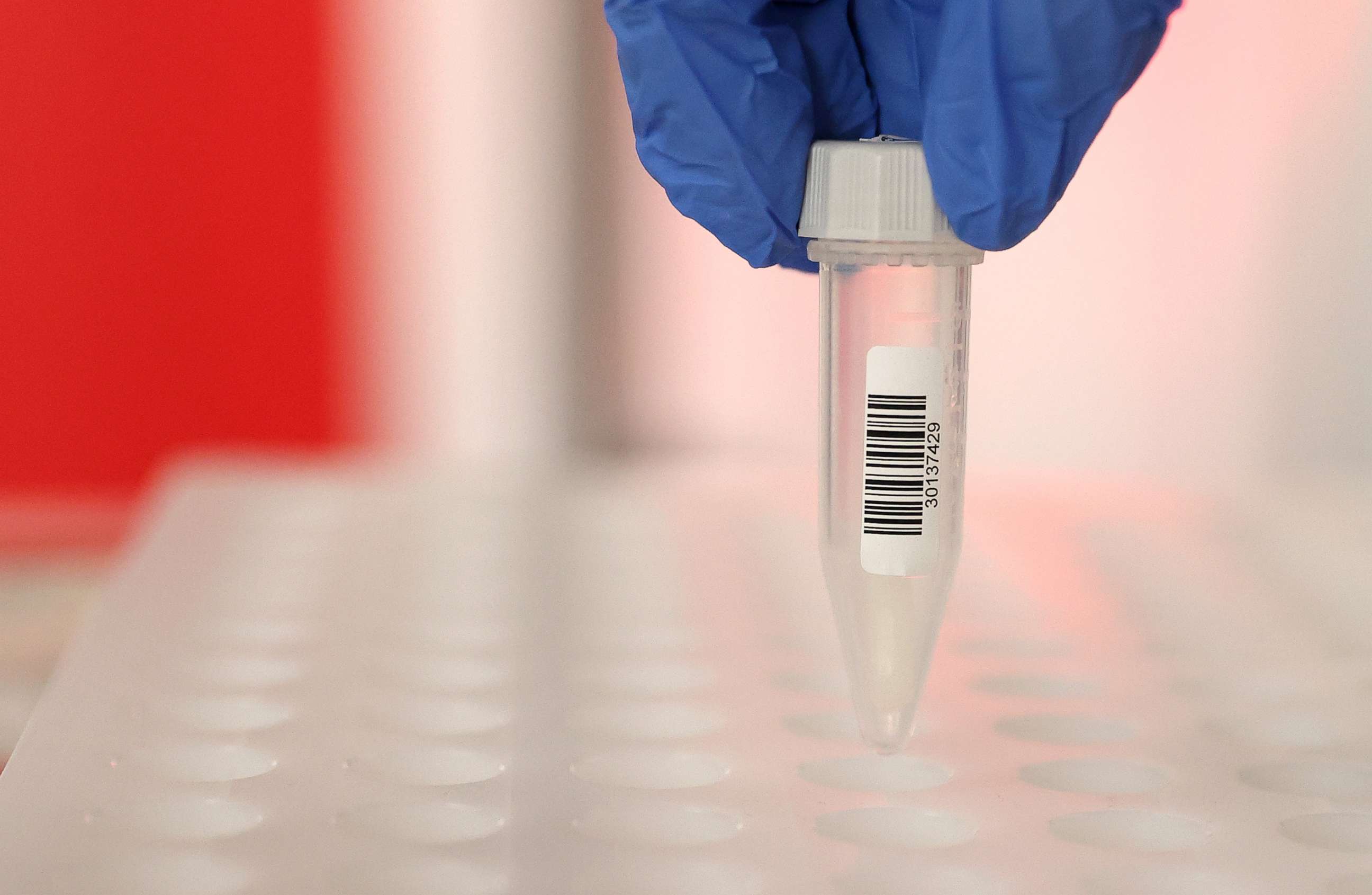PHOTO: A saliva sample is registered at Germany's first walk-through COVID-19 test center at the airport in Frankfurt, Germany, June 29, 2020.