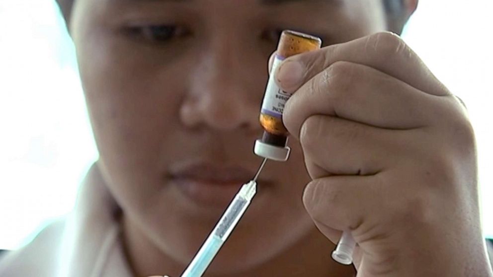 PHOTO: In this image made from video, a New Zealand health official prepares a measles vaccination at a clinic, Nov. 25, 2019, in Apia, Samoa.