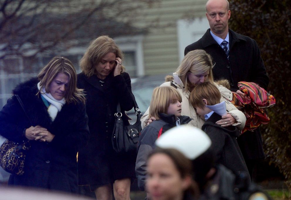 PHOTO: Mourners leave from Honan funeral home after attending the funeral for Jack Pinto, 6, one of the victims of the Sandy Hook elementary school shooting, Dec. 17, 2012, in Newtown, Connecticut.