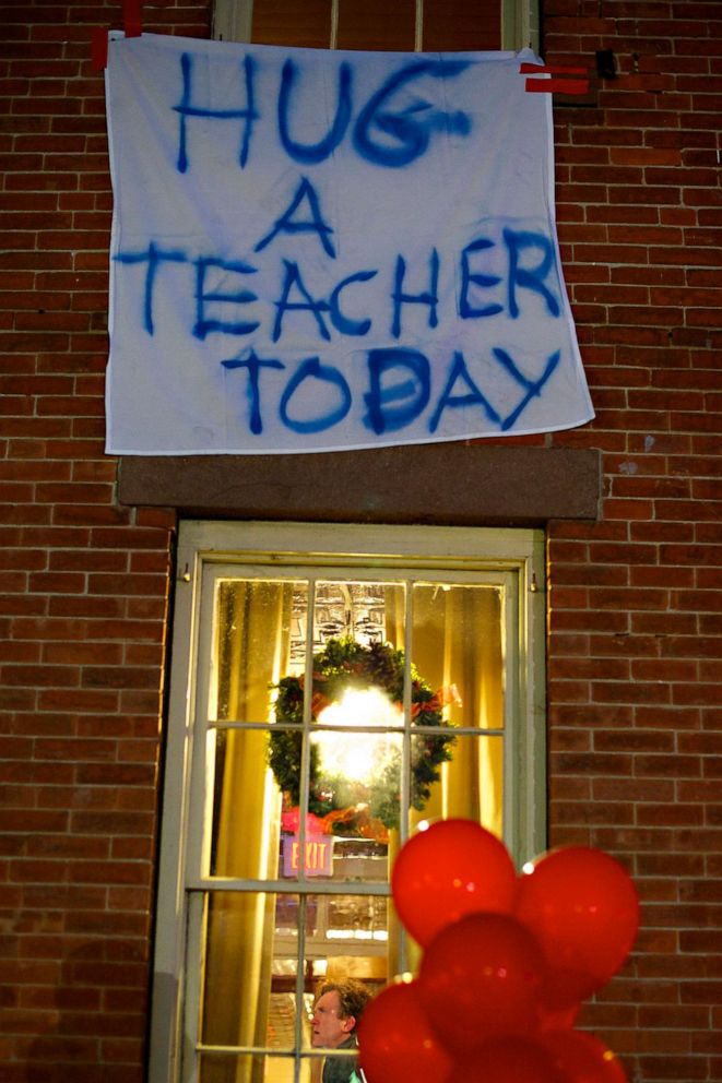 PHOTO: The day after the mass shooting at Sandy Hook Elementary School, in Sandy Hook, Conn., a sign hangs outside a building, on Dec. 14, 2012.