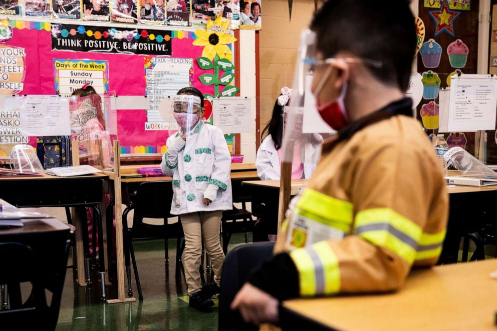 PHOTO: Kindergarten students wearing face shields and masks attend class at the Resurrection Catholic School amid coronavirus pandemic as the school reopens its doors for the first time in Boyle Heights, East Los Angeles, Calif., Feb. 1, 2021.