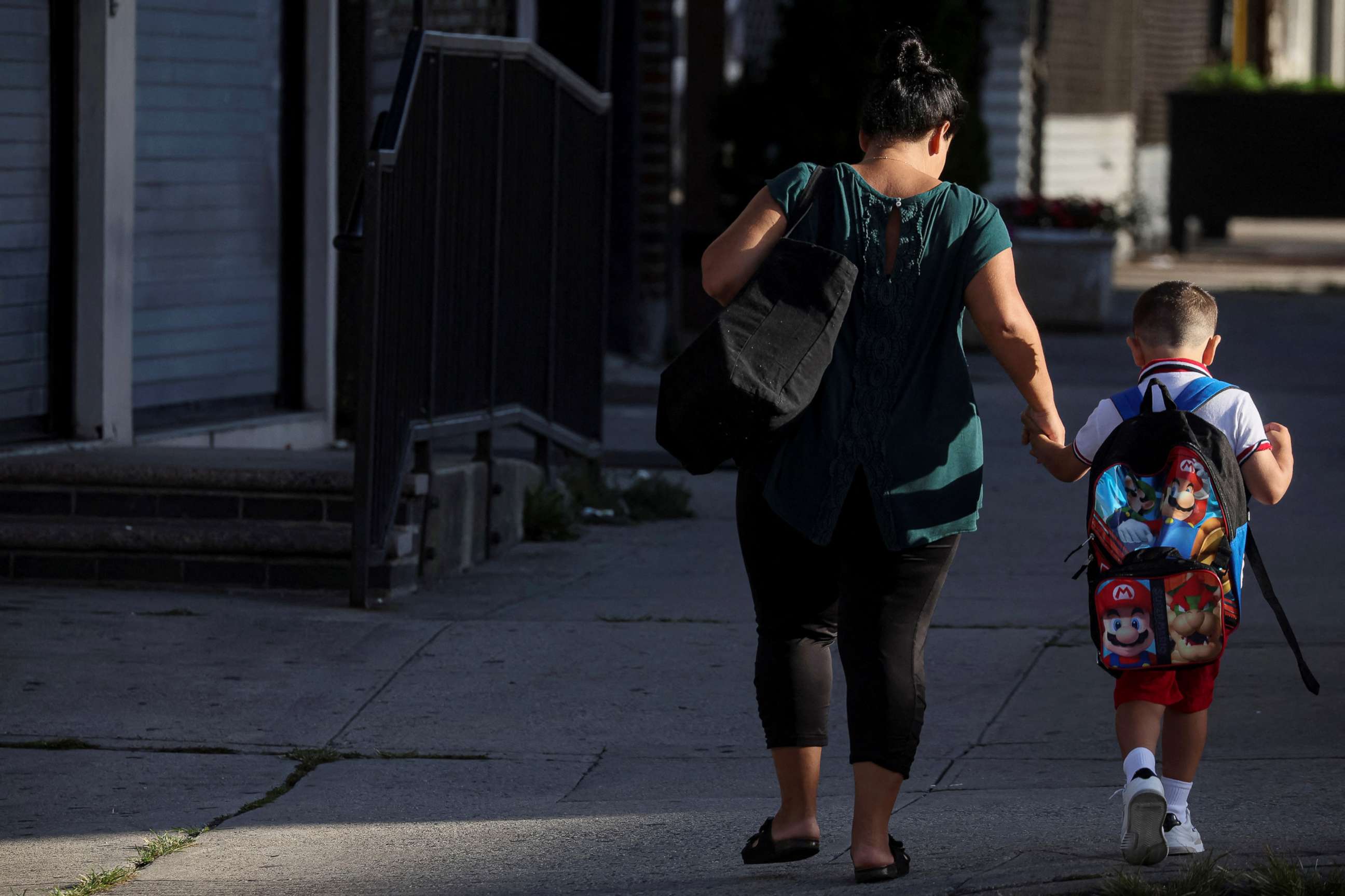 PHOTO: A parent and a child walk to school on the first day of New York City Public Schools in the Brooklyn  borough of New York, Sept. 8, 2022.