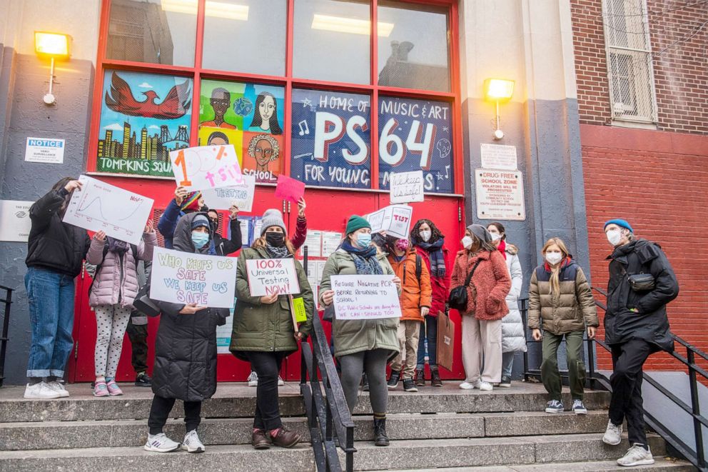 PHOTO: Teachers from the Earth School speak out on issues related to lack of Covid-19 testing outside of P.S. 64 in New York, Dec. 21, 2021. 