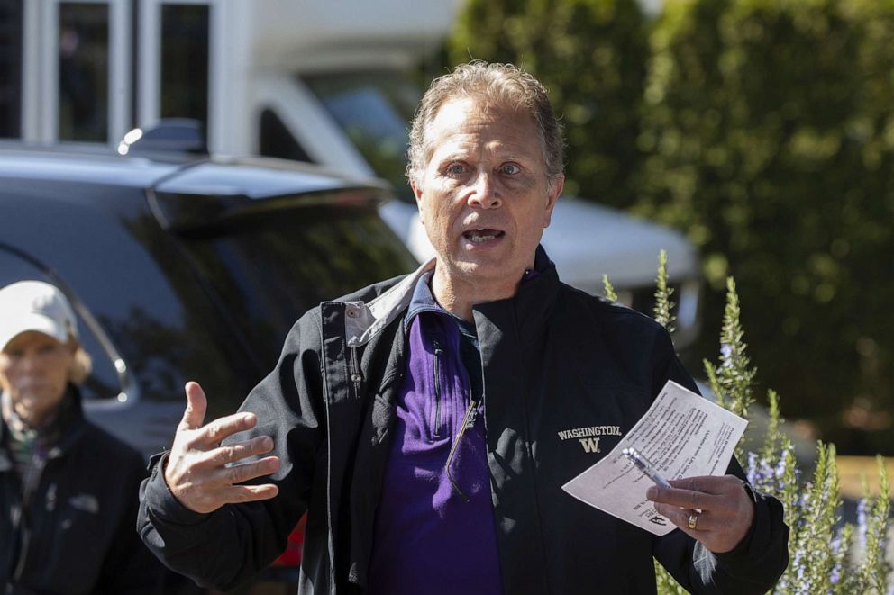 PHOTO: In this March 18, 2020, file photo, Scott Sedlacek commends the recent work of health care workers as he speaks to a spokesman for the Live Care Center in Kirkland, Wash.