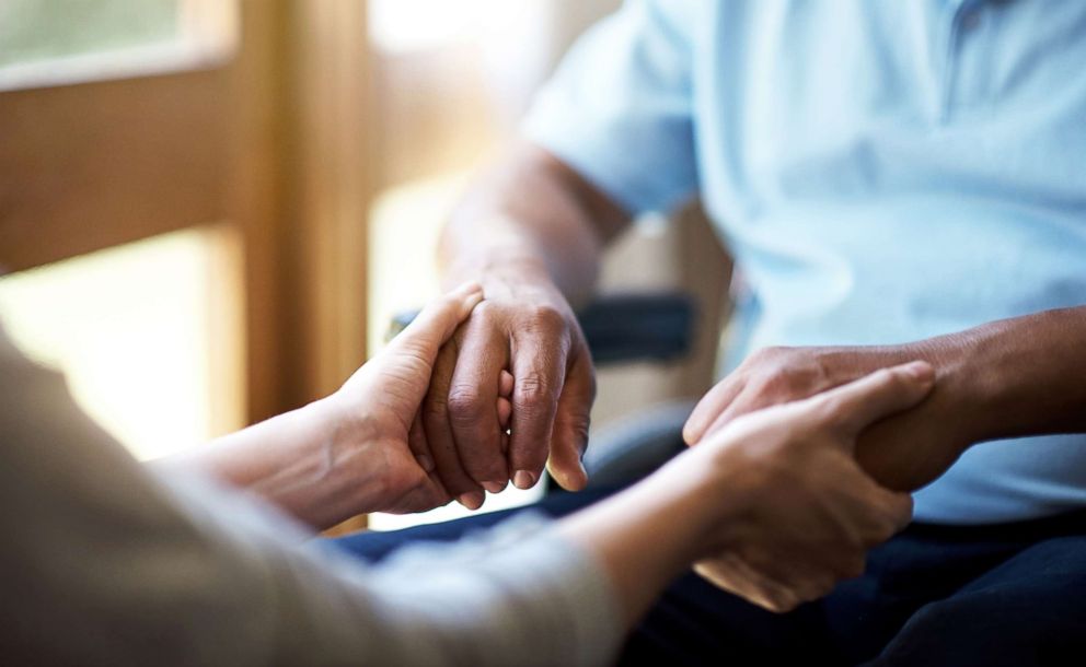 PHOTO: A nurse helps an elderly person in this stock photo.