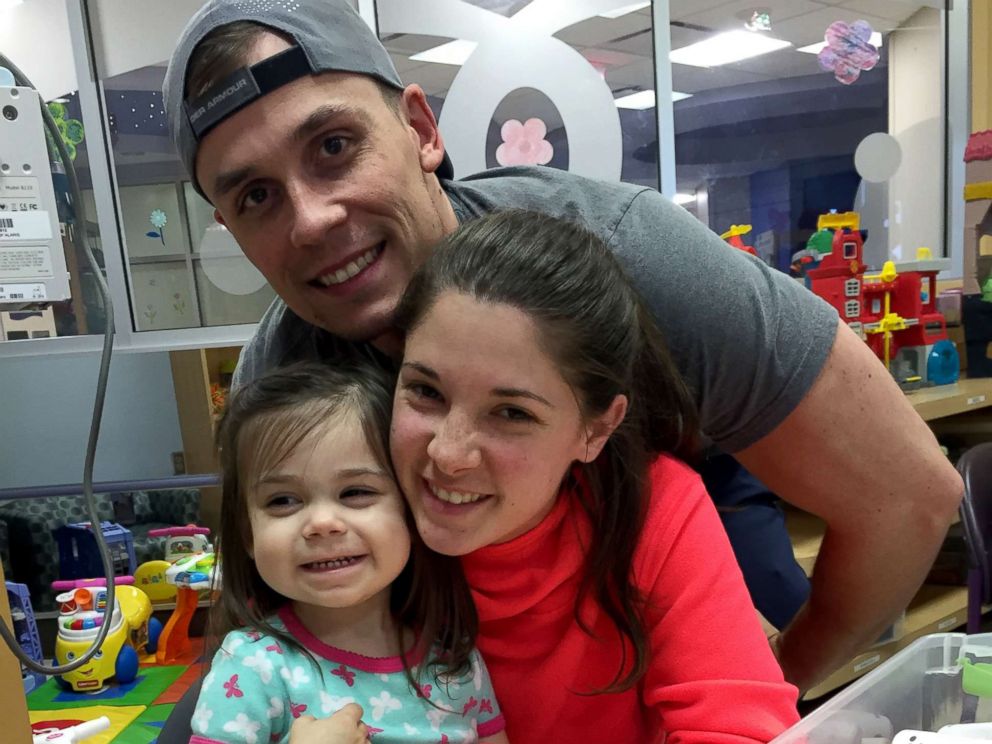 PHOTO: Shelby and Jonathan Skiles pose with their 2-year-old daughter Sophie who was diagnosed with T-cell lymphoma in May.