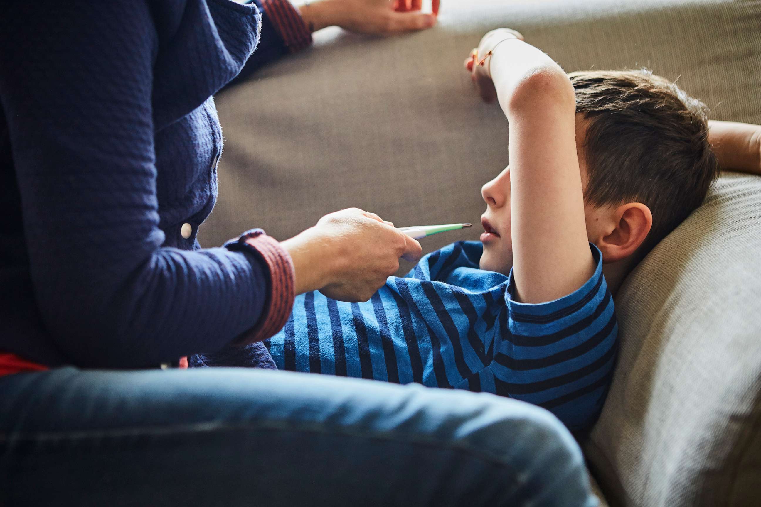 PHOTO: An adult takes a sick child's temperature in an undated stock photo.