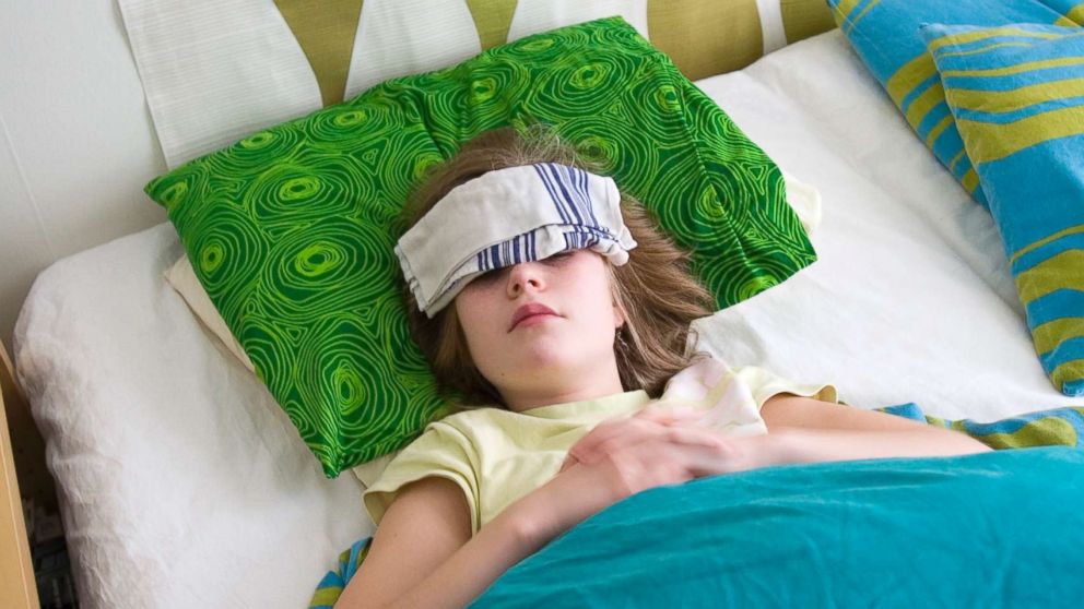 PHOTO: A sick girl lies in bed in this undated stock photo.