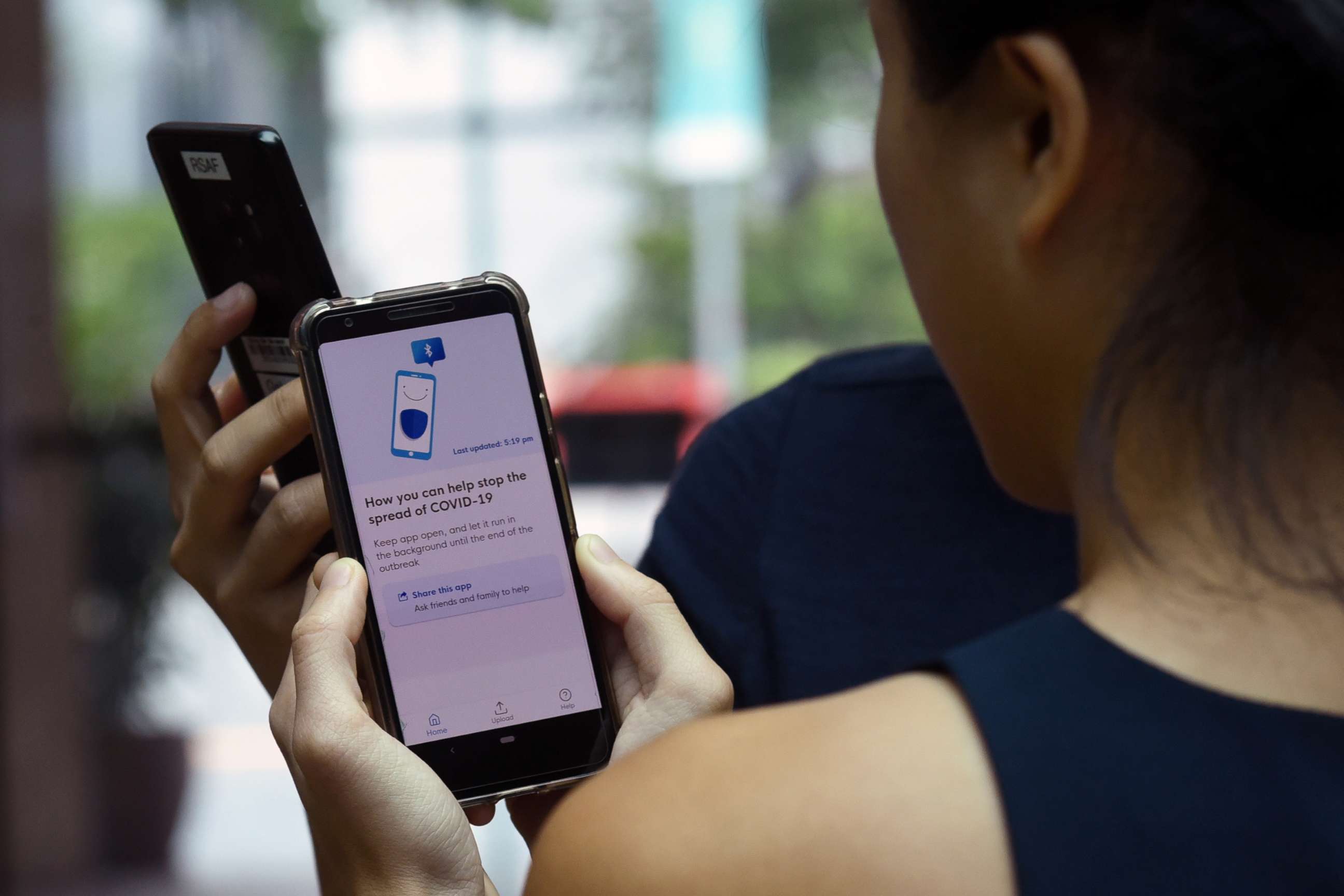 PHOTO: Government Technology Agency (GovTech) staff demonstrate Singapore's new contact-tracing smart phone app called TraceTogether, as a preventive measure against the COVID-19 coronavirus in Singapore, March 20, 2020.