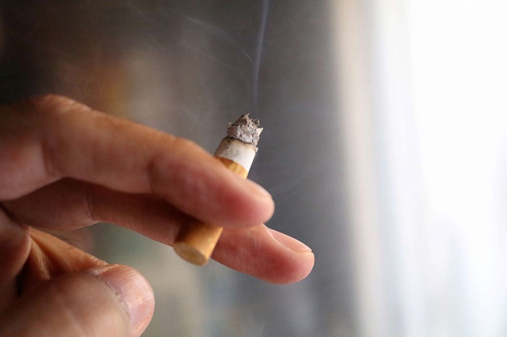 PHOTO: A hand is pictured holding a burning cigarette in this undated stock photo.