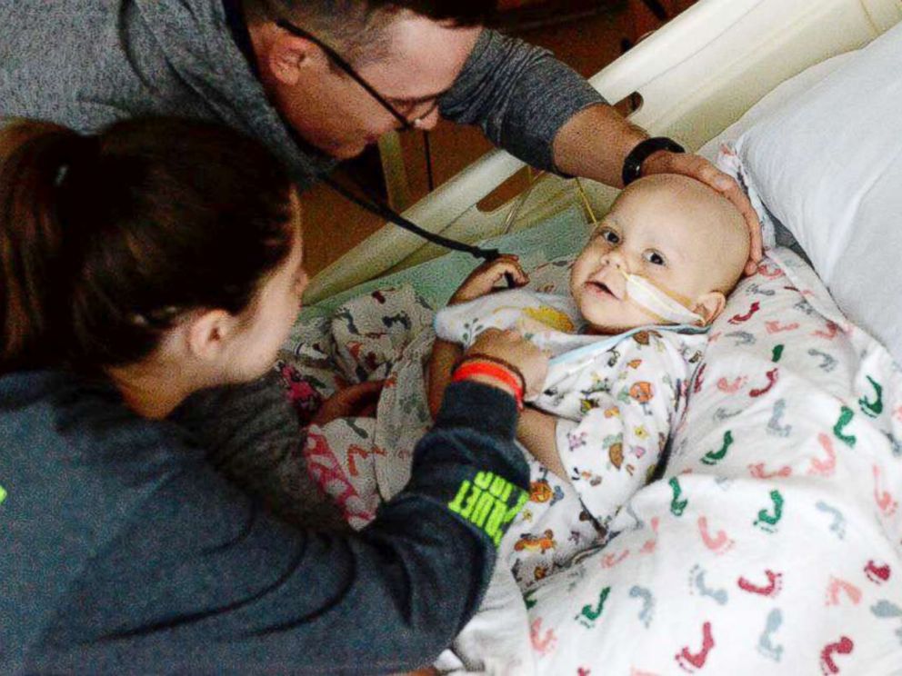 Shelby and Jonathan Skiles care for their 2-year-old daughter Sophie at Children's Medical Center Dallas.