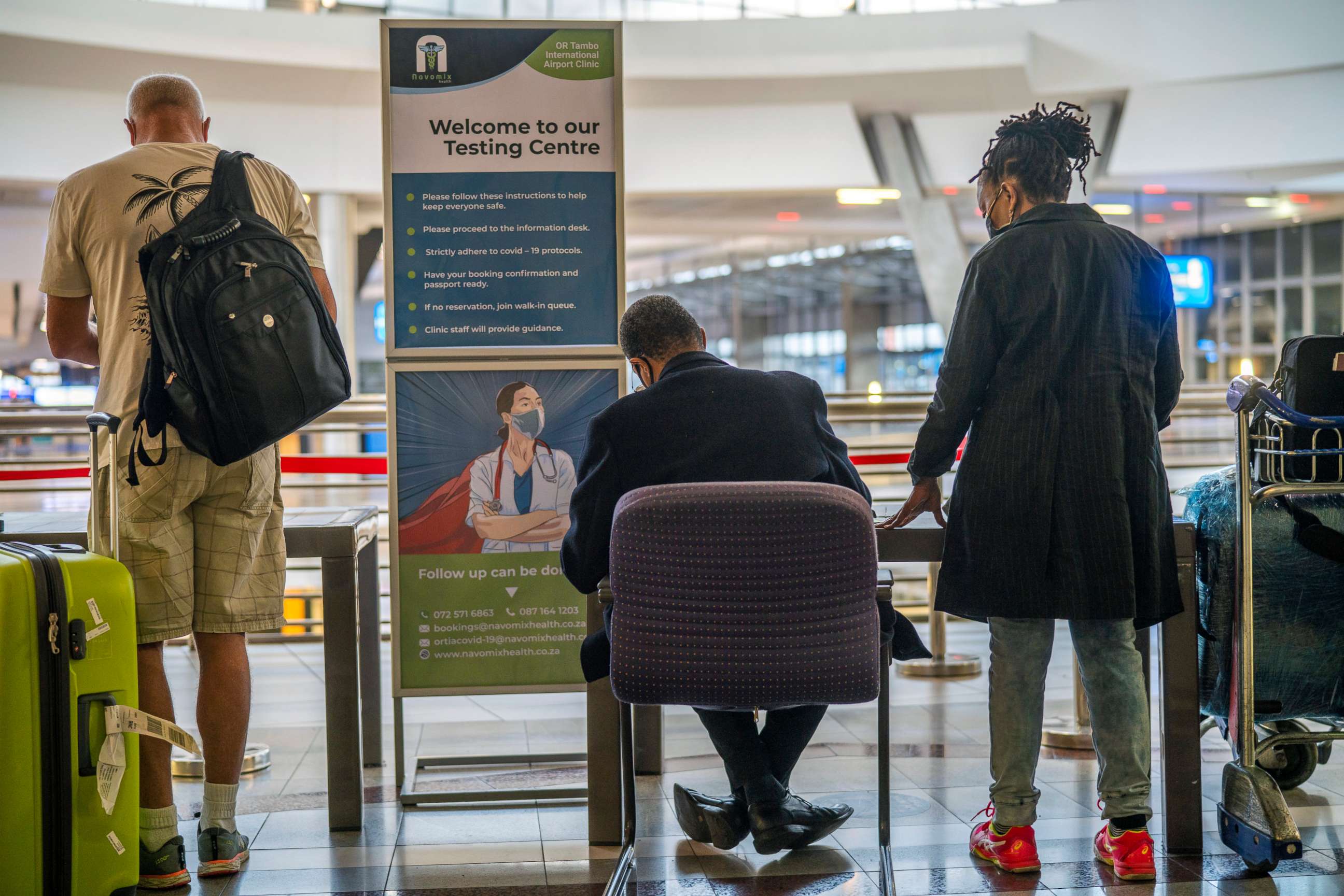 PHOTO: People lineup to get tested for Covid at OR Tambo's airport in Johannesburg, South Africa, Nov. 26, 2021.