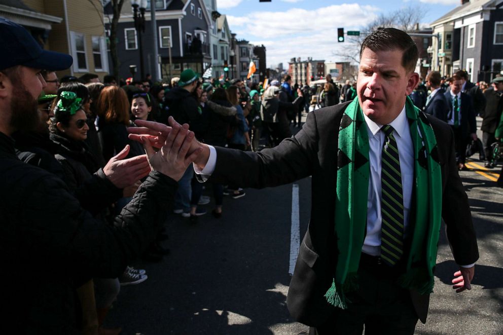 PHOTO: Boston Mayor Martin J. Walsh shakes hands with people in the crowd during the annual St. Patrick's Day parade in South Boston on March 17, 2019.