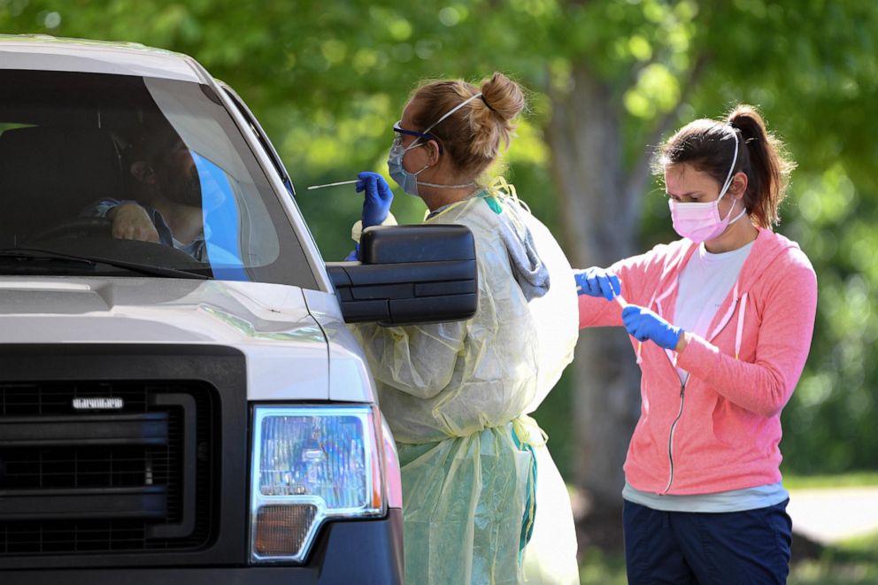 PHOTO:Healthcare workers collect COVID-19 test samples collected from Duke Energy workers who voluntarily get the test at the Civic Center of Anderson, S.C., April 27, 2020. 