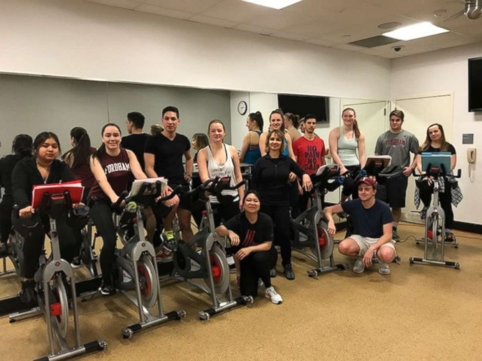 PHOTO: Professor Julita Haber spins with students at Fordham University.