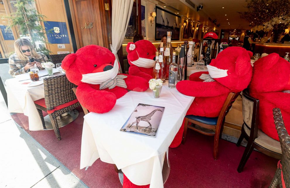 PHOTO: Stuffed bears wearing face masks mark social distancing spacing among diners outside Nello restaurant on the Upper East Side of New York, March 23, 2021.